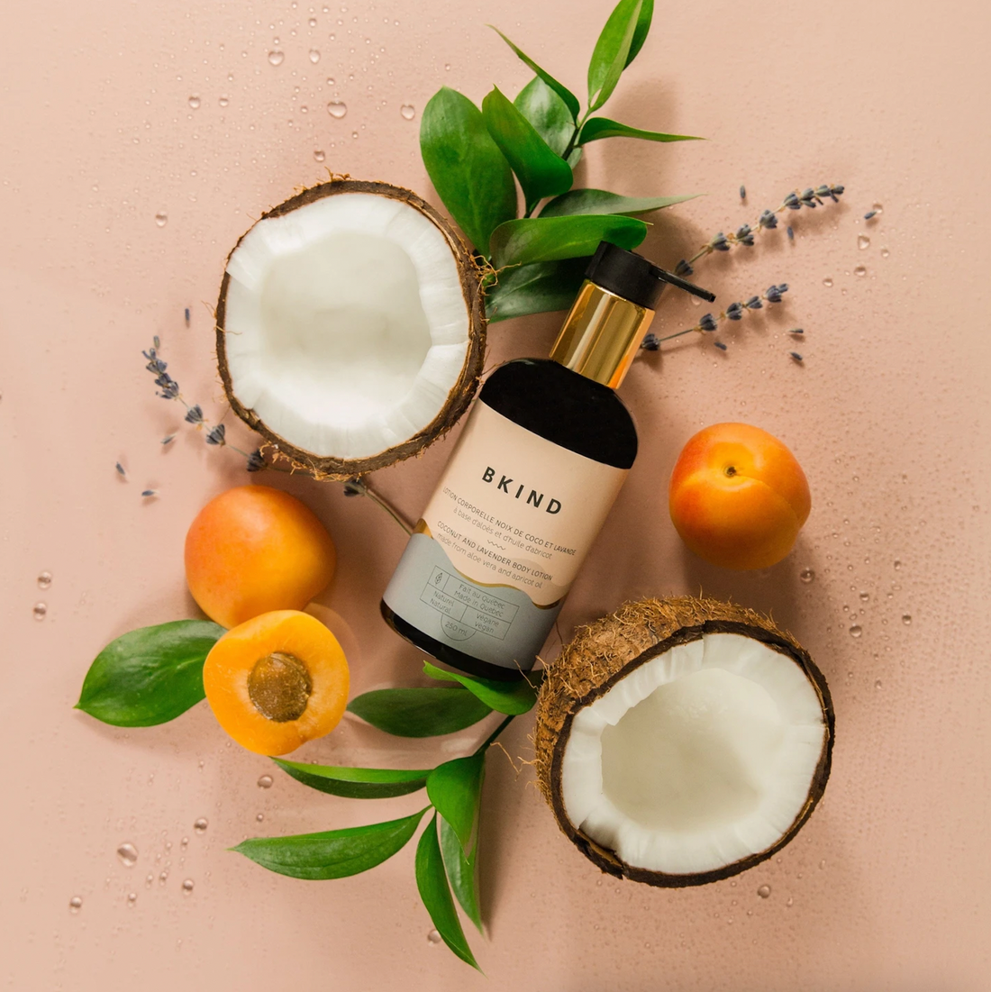 A top-down photo of a body lotion bottle with fresh ingredients surrounding it. 
